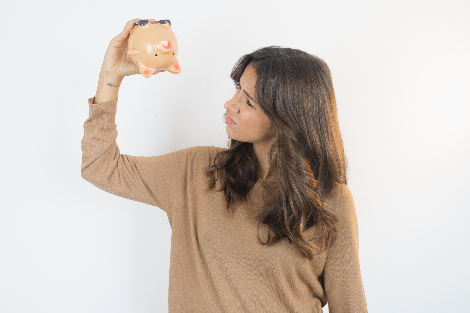 Sad Woman with an Empty Piggy Bank