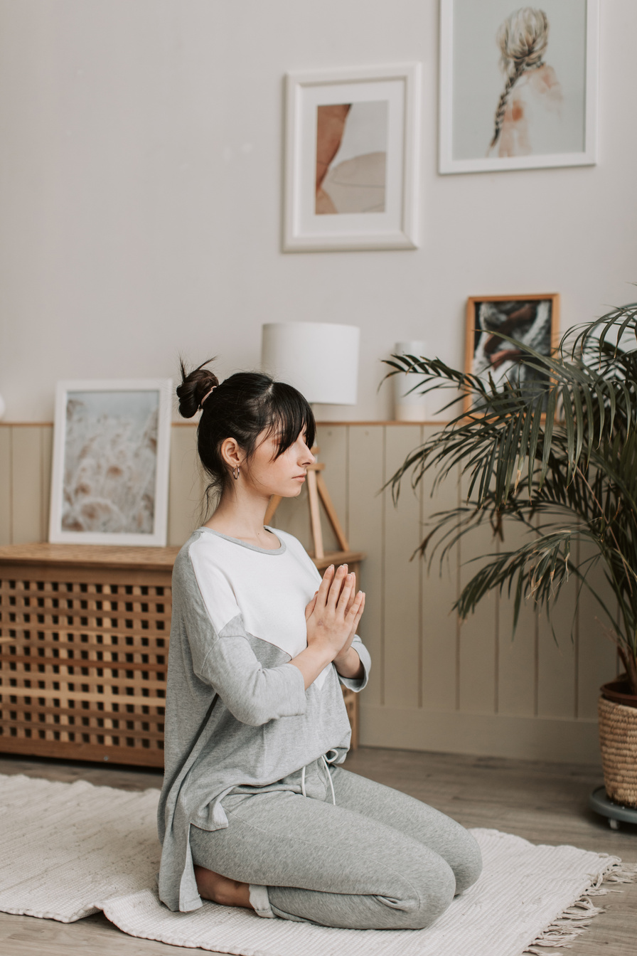 Woman Meditating at Home